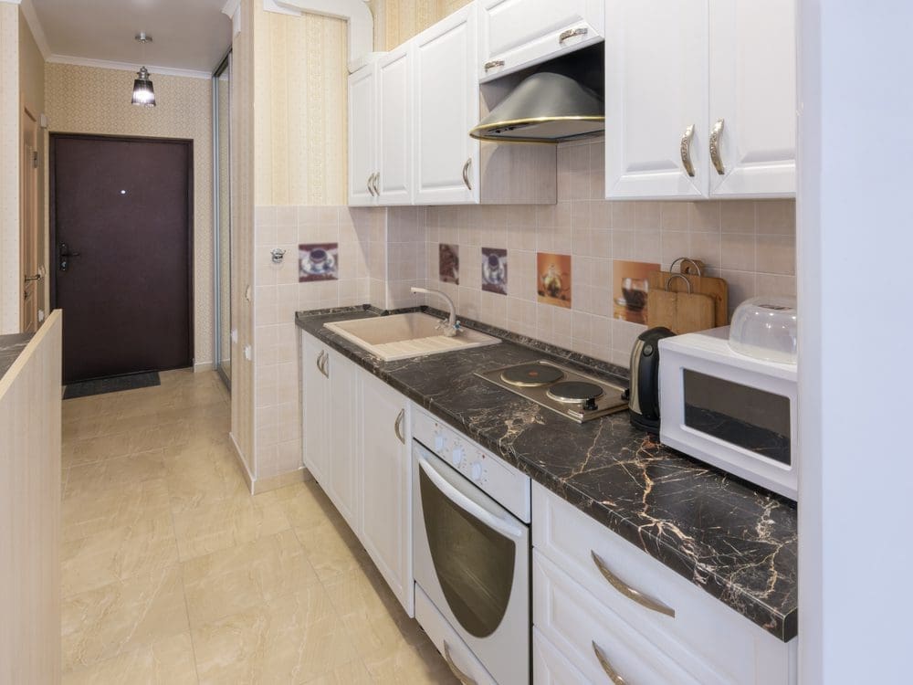 Interior,Of,A,One-room,Apartment,,View,From,The,Kitchen,To