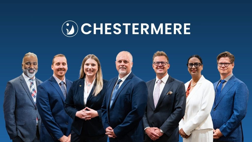 City Council members stand beside one another.