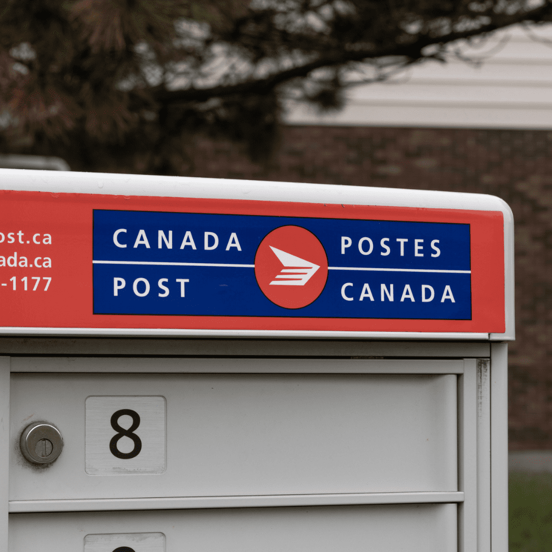 A close up of a community mailbox. The Canada Post Logo is visible.