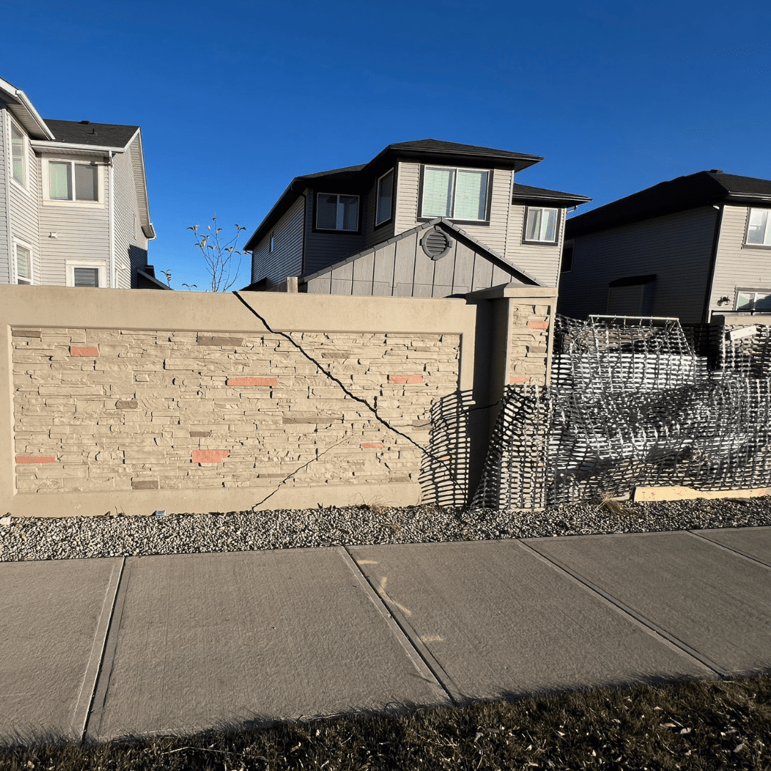 A crack in a stone sound wall on Rainbow Road