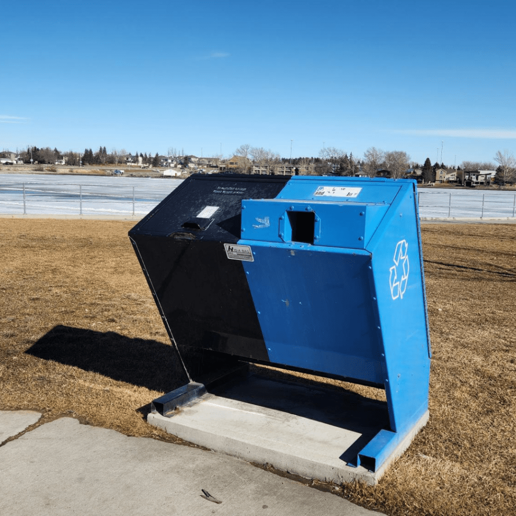 Black and blue trash receptacles