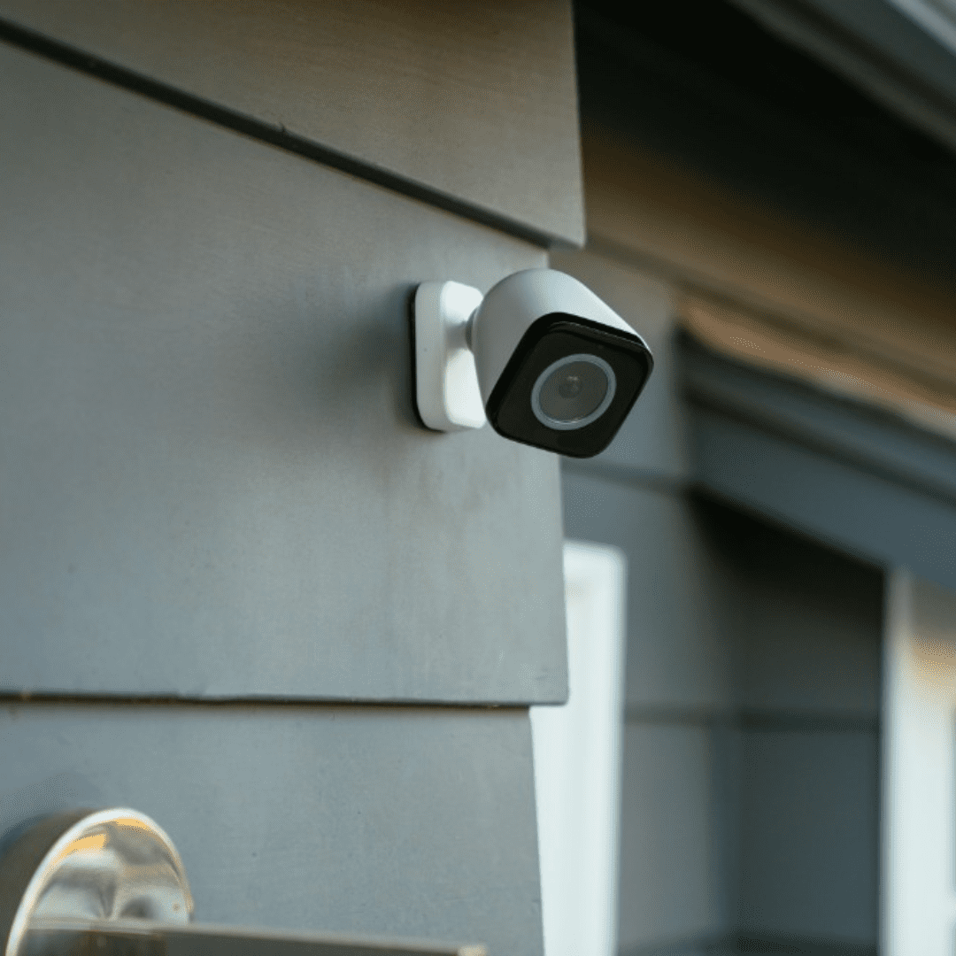 A camera is seen on the side of a home