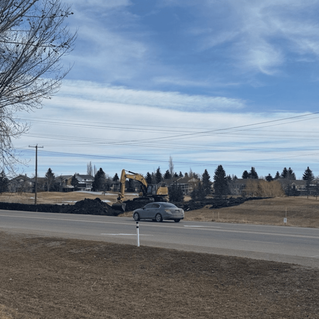 Construction equipment working alongside Chestermere Boulevard.